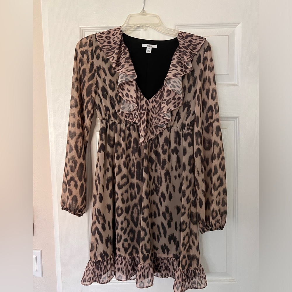 L/S sheer sexy dress with liner. Very light. Above knee. Never worn